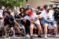A New Black City dancer leads the crowd.